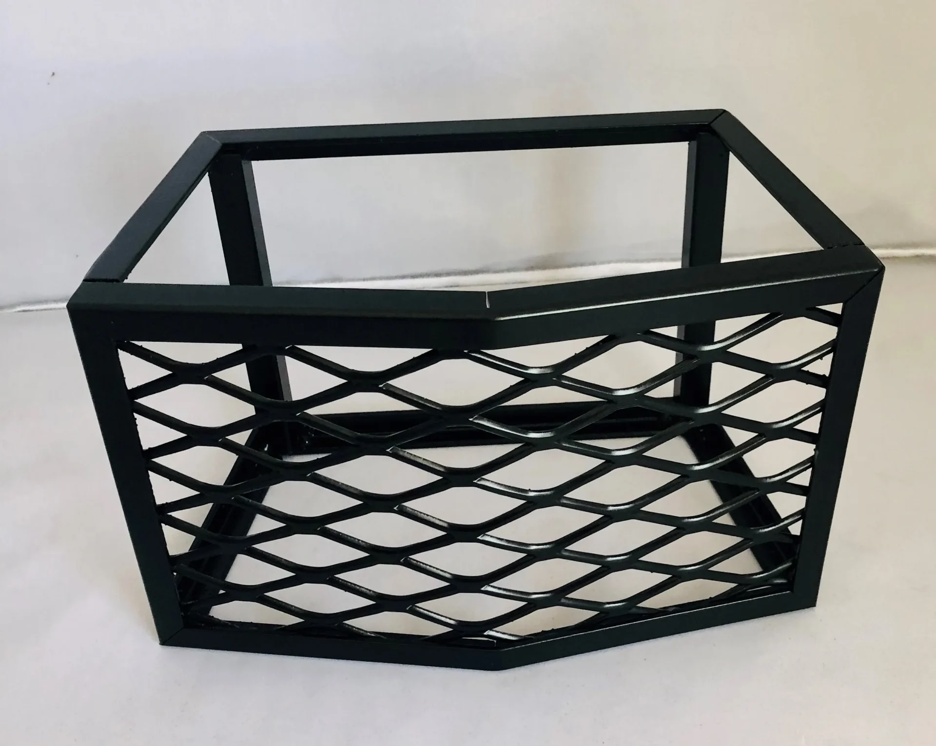 A black basket with a white background